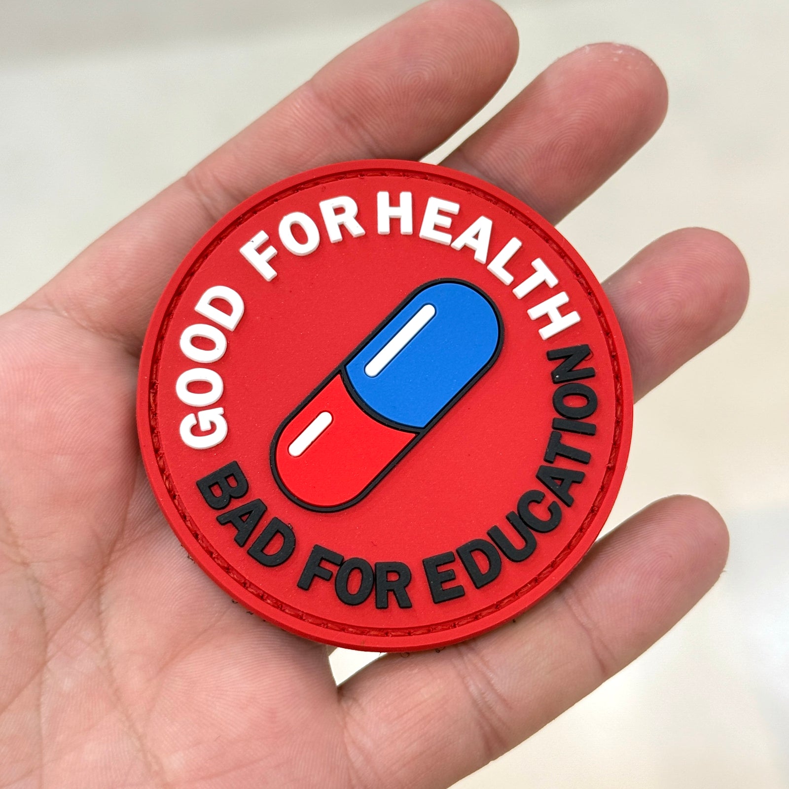 Detail of Akira Good for Health Bad for Education PVC patch – Akira Gallery