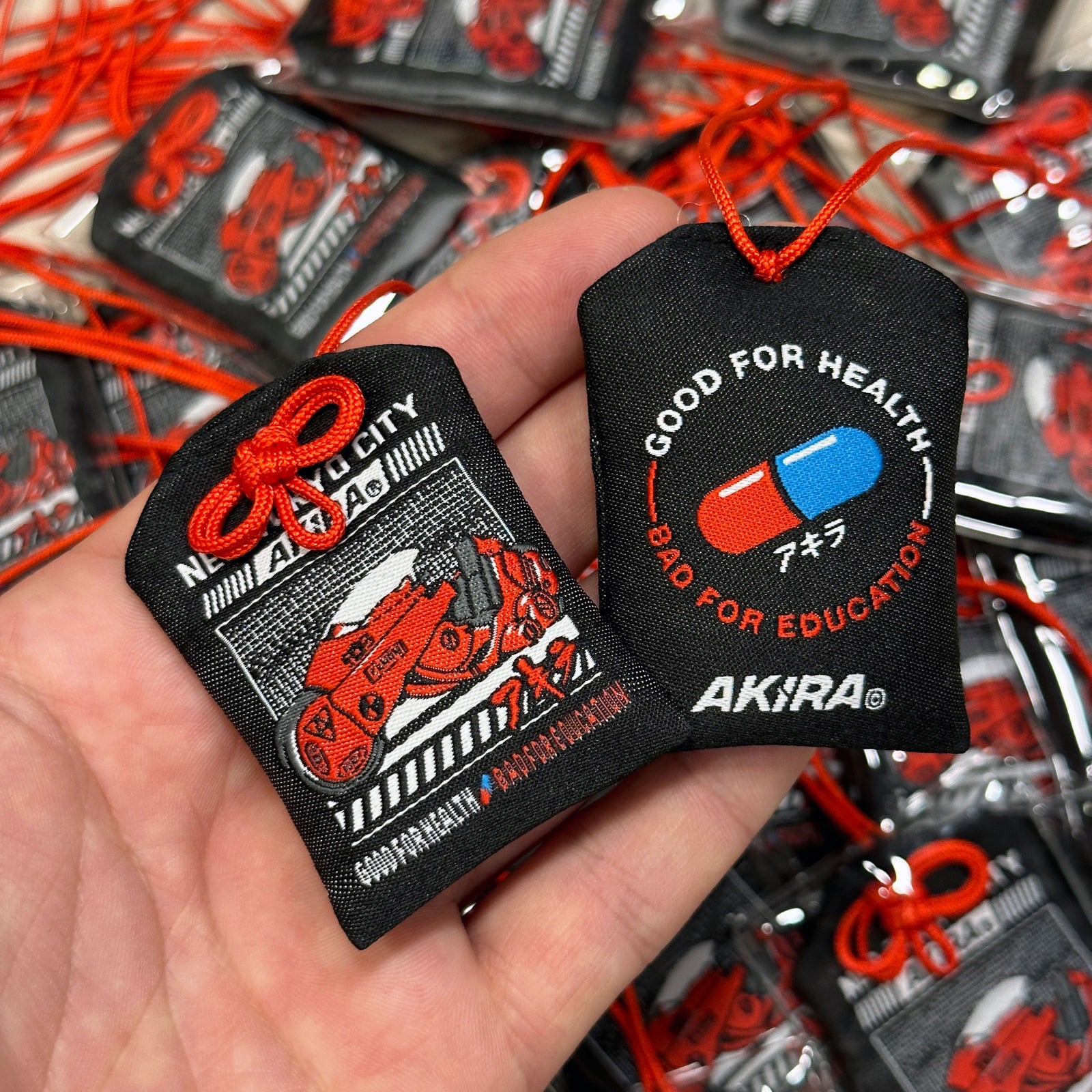 Anime-inspired Akira Japanese style omamori charm
