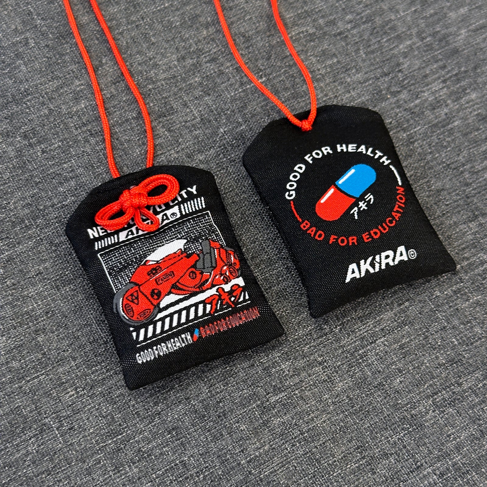 Akira omamori with iconic motorcycle design on front
