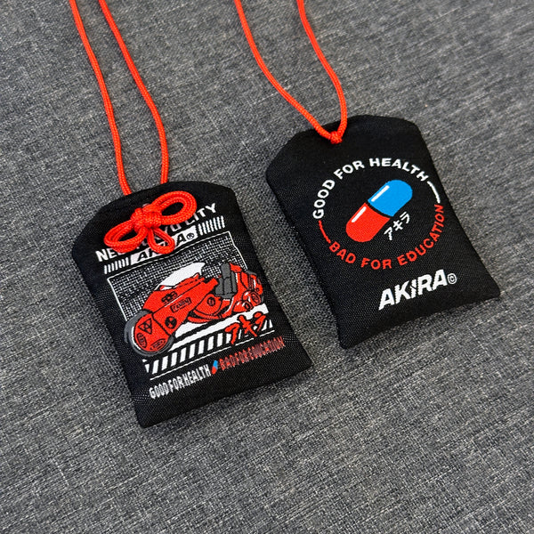 Akira omamori with iconic motorcycle design on front
