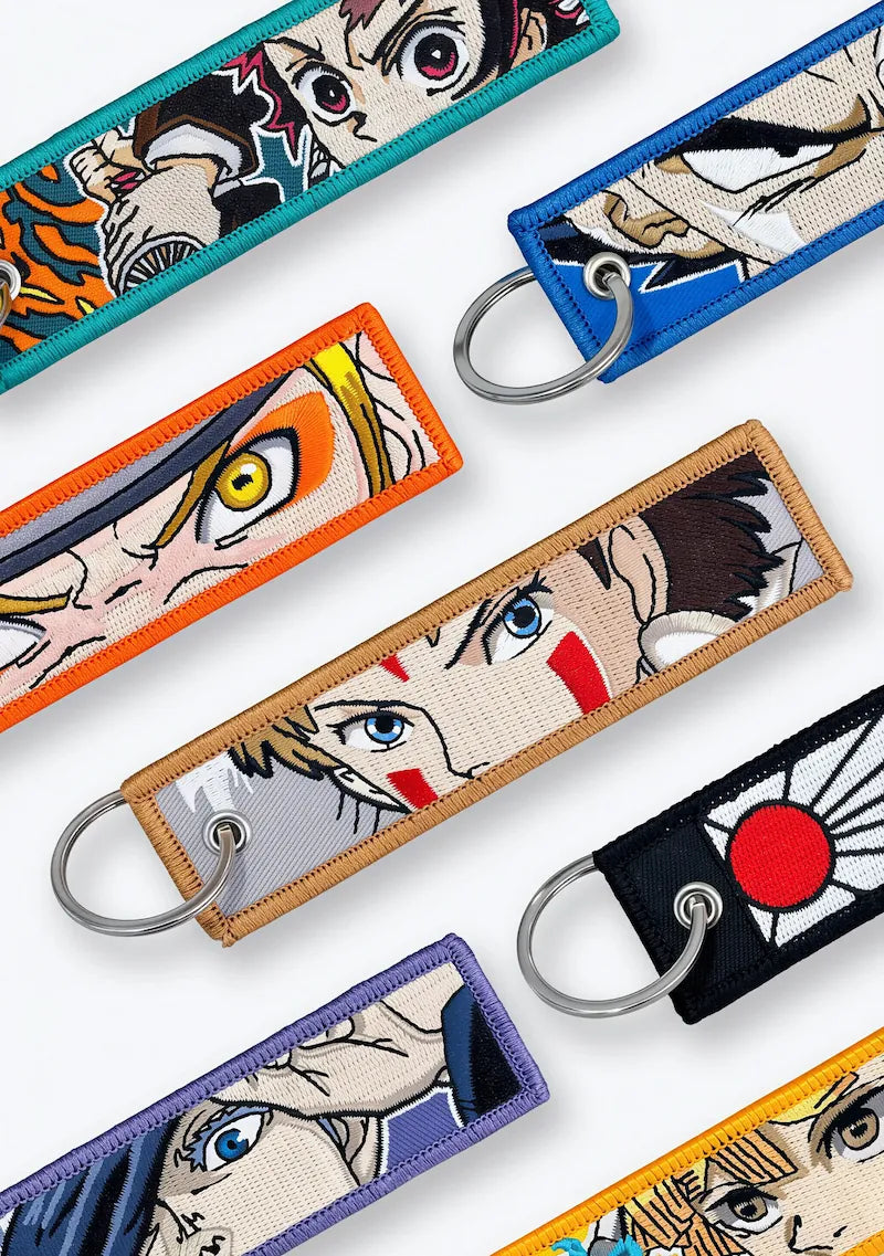 Close-up of colourful embroidered anime keytags
