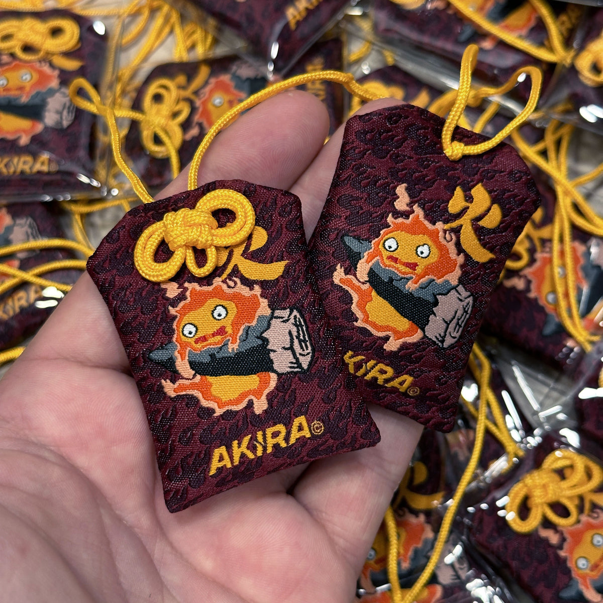 Anime-inspired Calcifer Japanese style omamori charm
