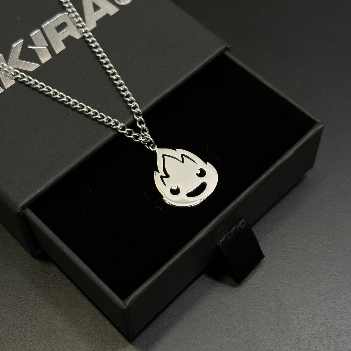 Minimalist Calcifer pendant necklace inspired by howls moving castle anime
