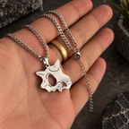 Cubone Stainless Steel Necklace from anime Pokemon held by hand