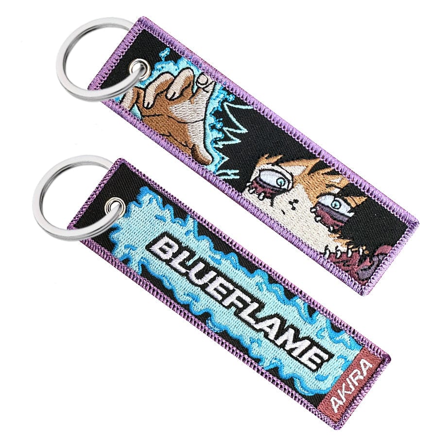 Double-sided embroidered keychain of Dabi from My Hero Academia. One side features the word &quot;Blueflame&quot; with a red &quot;AKIRA&quot; label, and the other side shows Dabi&#39;s face and raising his hand