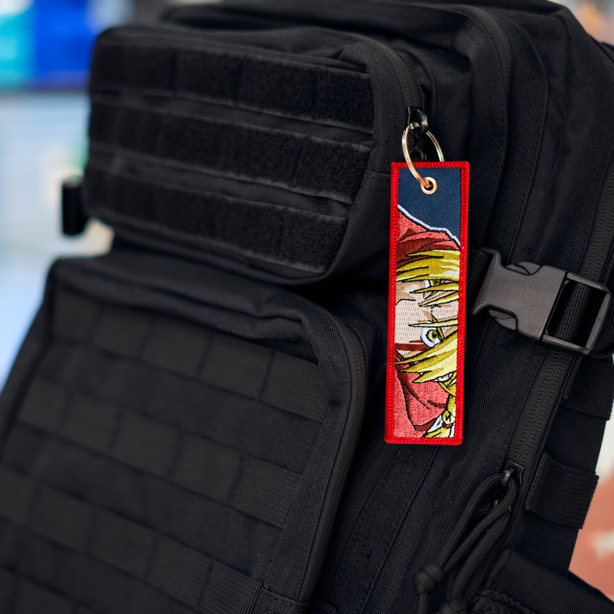 Detail of Edward Elric embroidered keychain – soft fabric anime keychain – Akira Gallery
