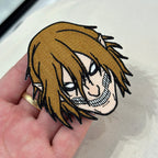 Display of Eren Titan embroidered patch showing textured stitching – anime patch – Akira Gallery
