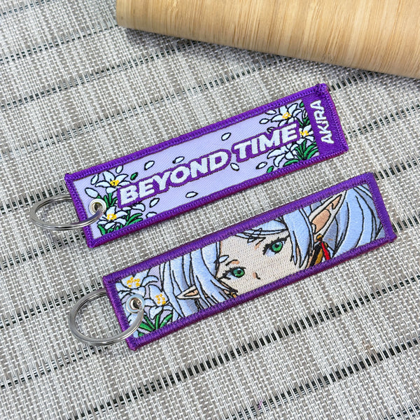 Frieren embroidered keychain in purple fabric