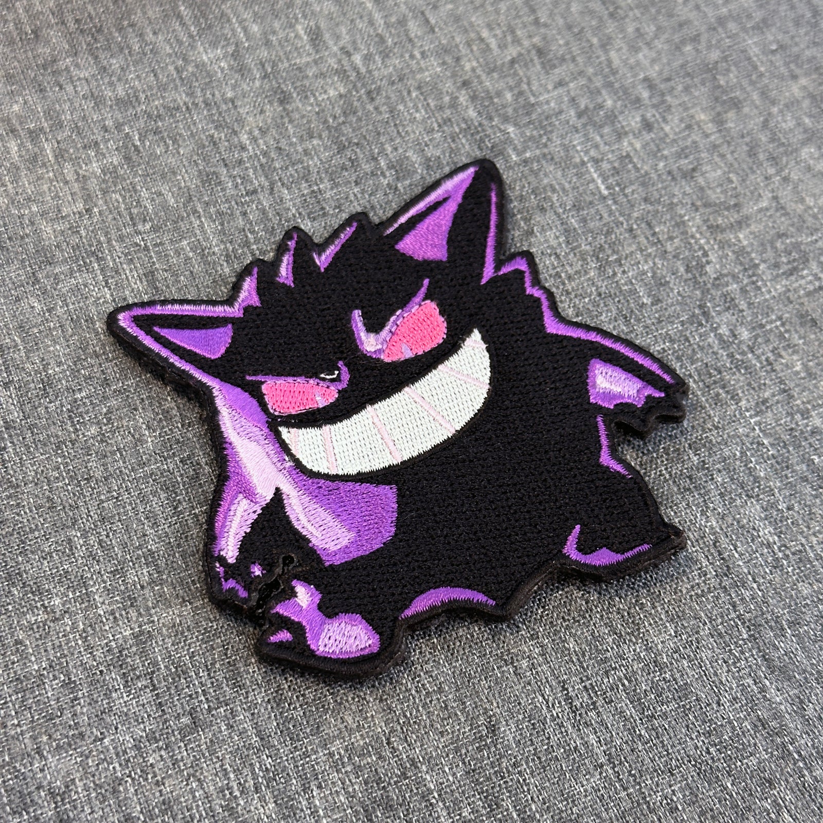 Detail of Gengar embroidered anime patch – Akira Gallery
