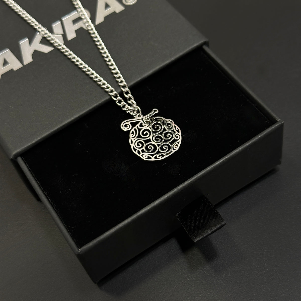 Anime-inspired Gomu Gomu Devil Fruit necklace in stainless steel
