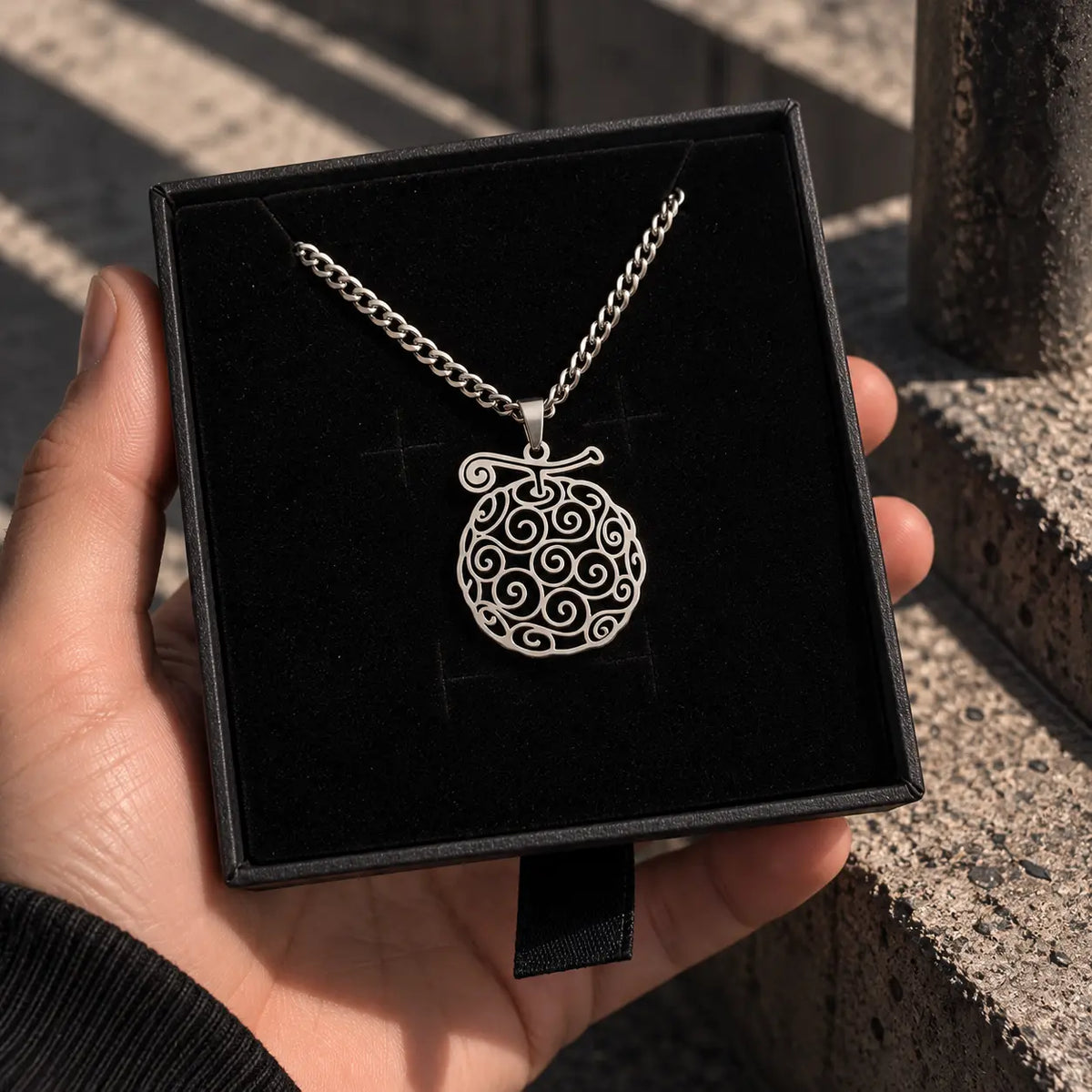 Gomu Gomu Stainless Steel Necklace from anime One Piece displayed on a box