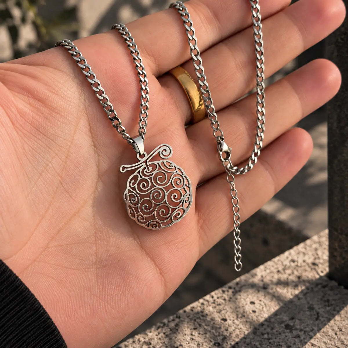 Gomu Gomu Stainless Steel Necklace from anime One Piece held by hand