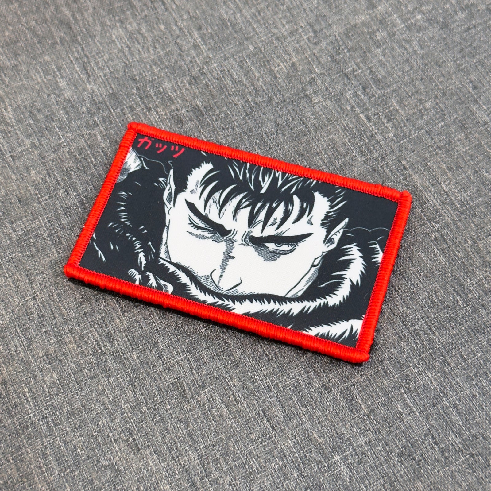 Display of Guts sublimated anime patch inspired by Berserk with velcro backing – Akira Gallery

