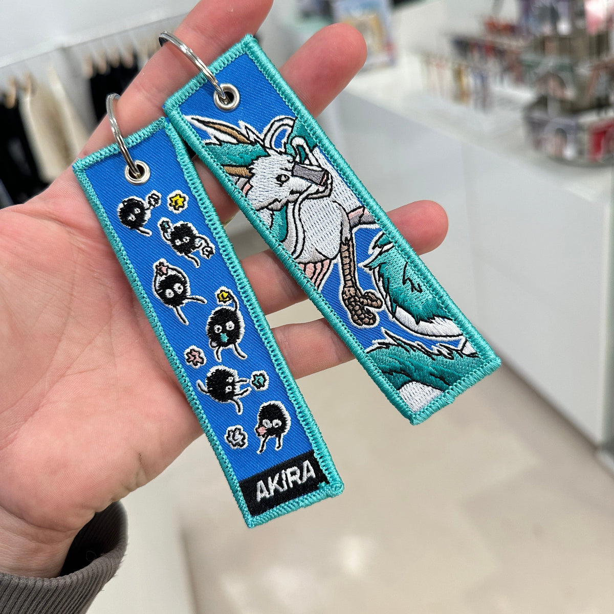 Detail of Haku embroidered keychain – soft fabric anime keychain – Akira Gallery
