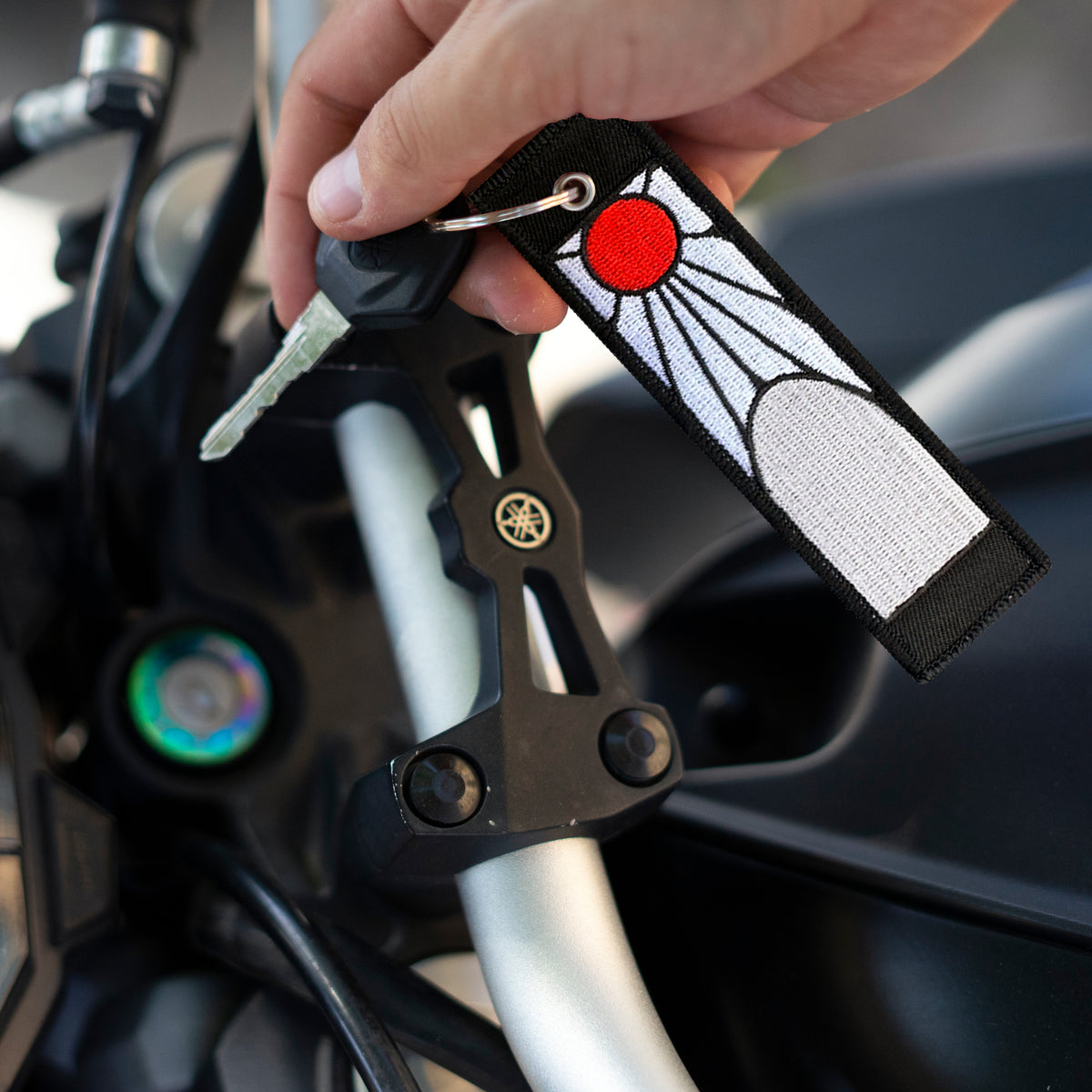 Detail of Hanafuda earrings embroidered keychain inspired by Tanjiro – Akira Gallery
