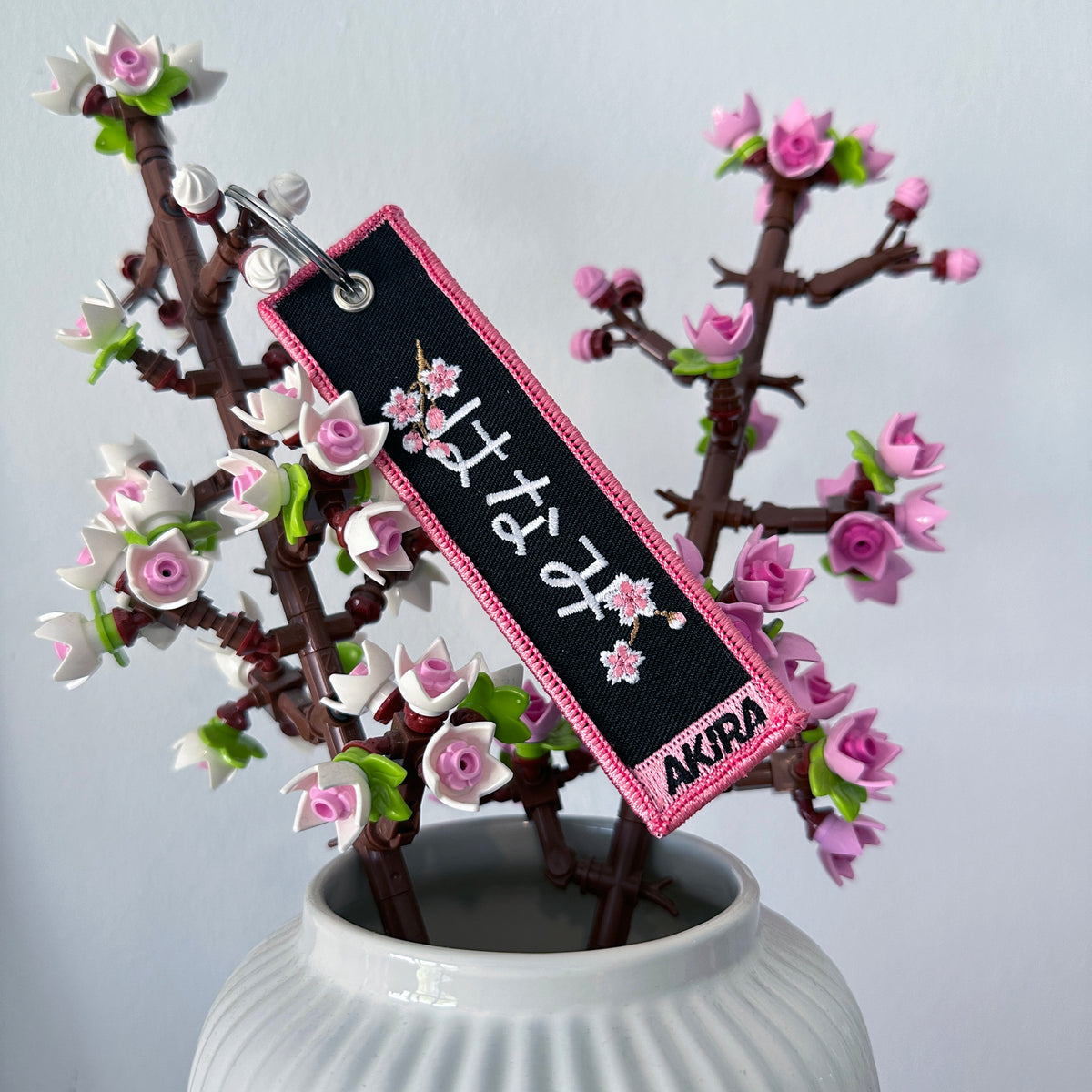 Back view of Hanami embroidered keychain – embroidered keychain – Akira Gallery
