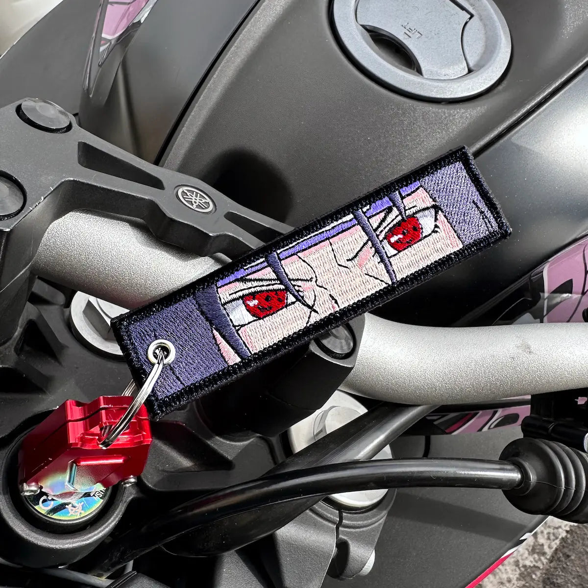 itachi embroidered keytag from anime naruto on a motorbike key