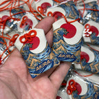 Japanese style omamori featuring the Great Wave of Kanagawa
