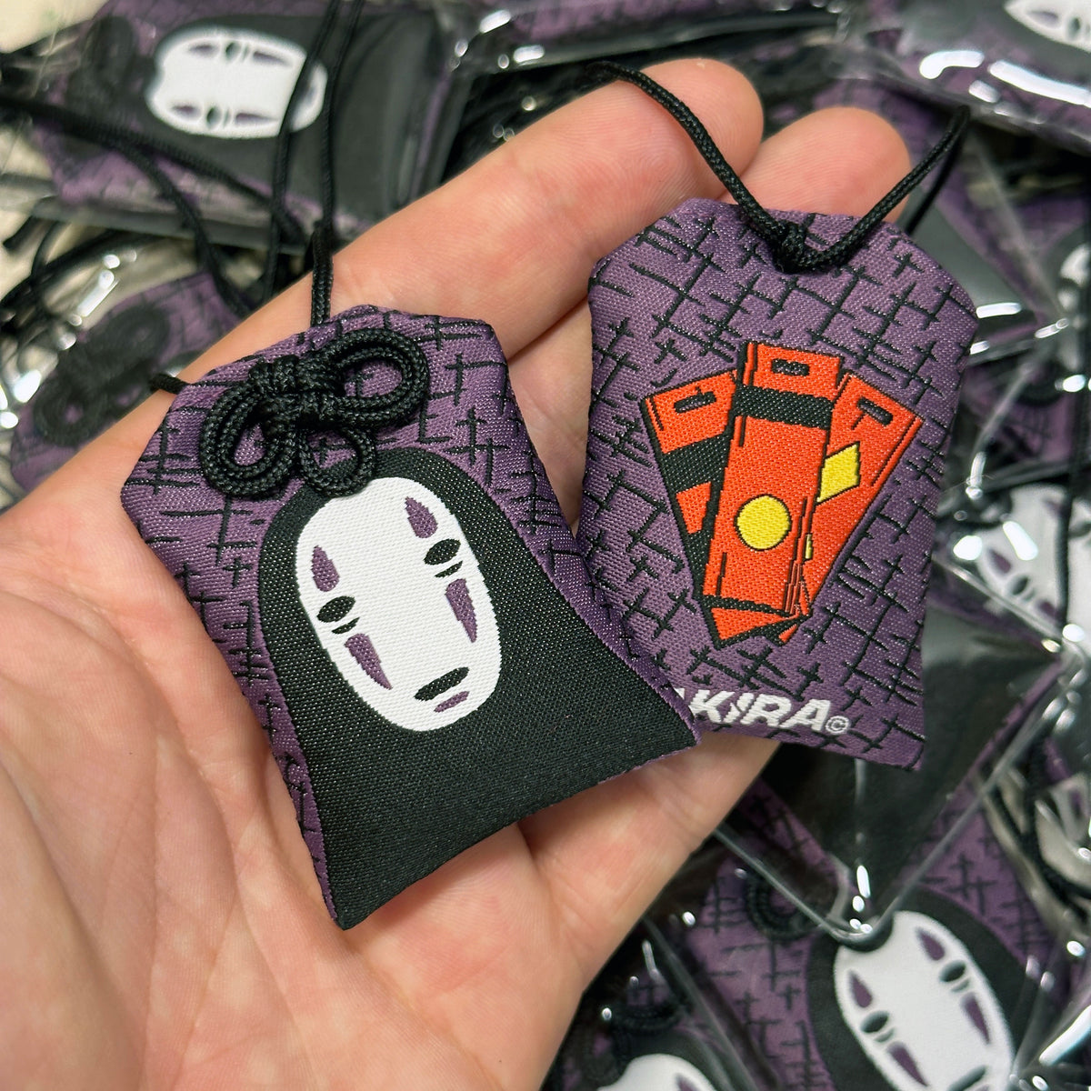 Anime-inspired Kaonashi Japanese style omamori charm
