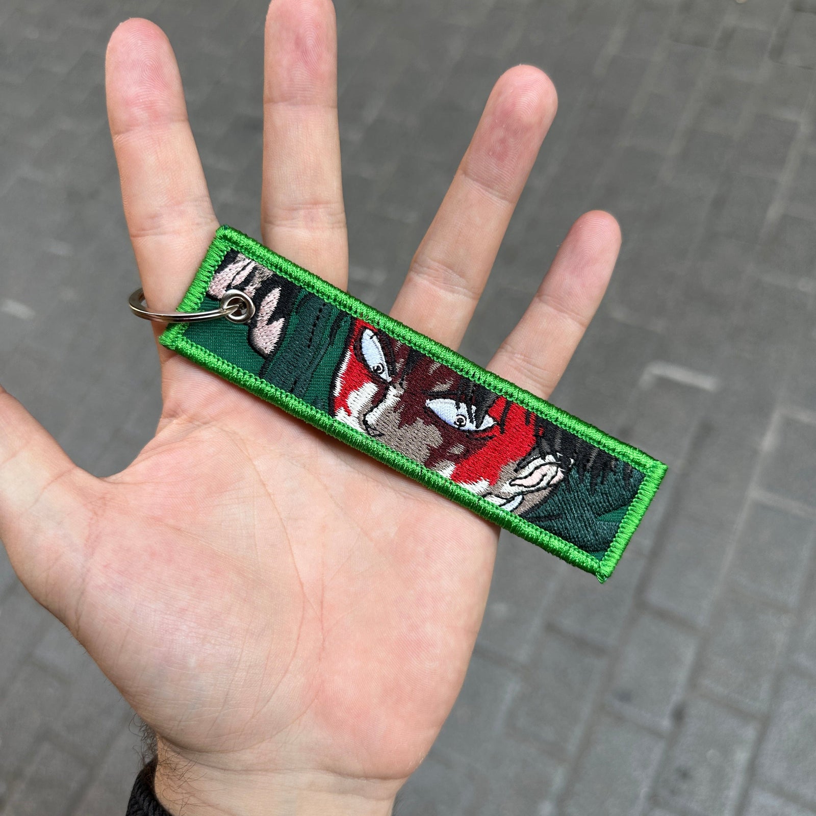 Front view of Levi Ackerman embroidered keychain – anime keychain – Akira Gallery
