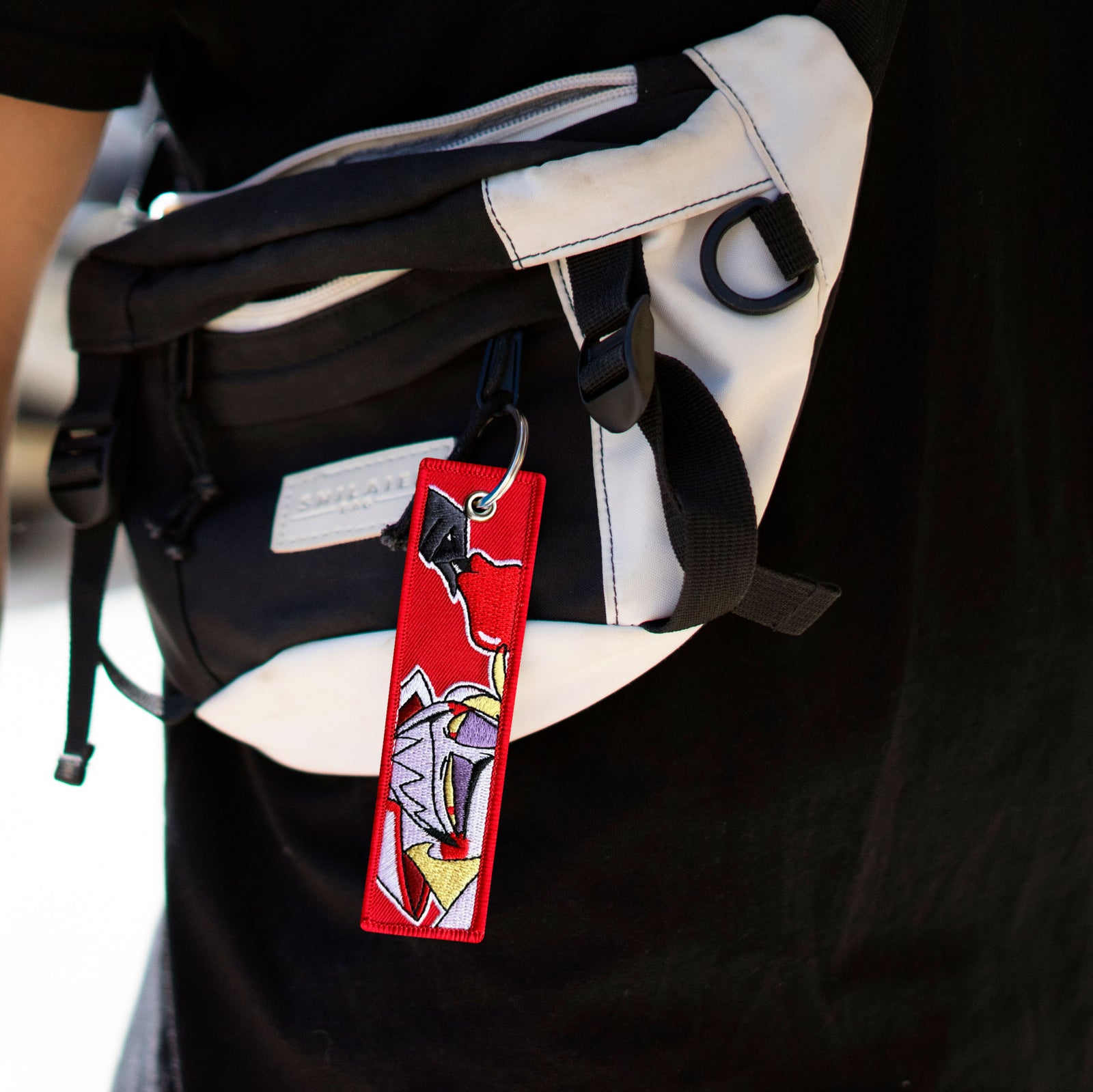 Detail of Lucifer embroidered keychain – soft fabric anime-style keychain – Akira Gallery
