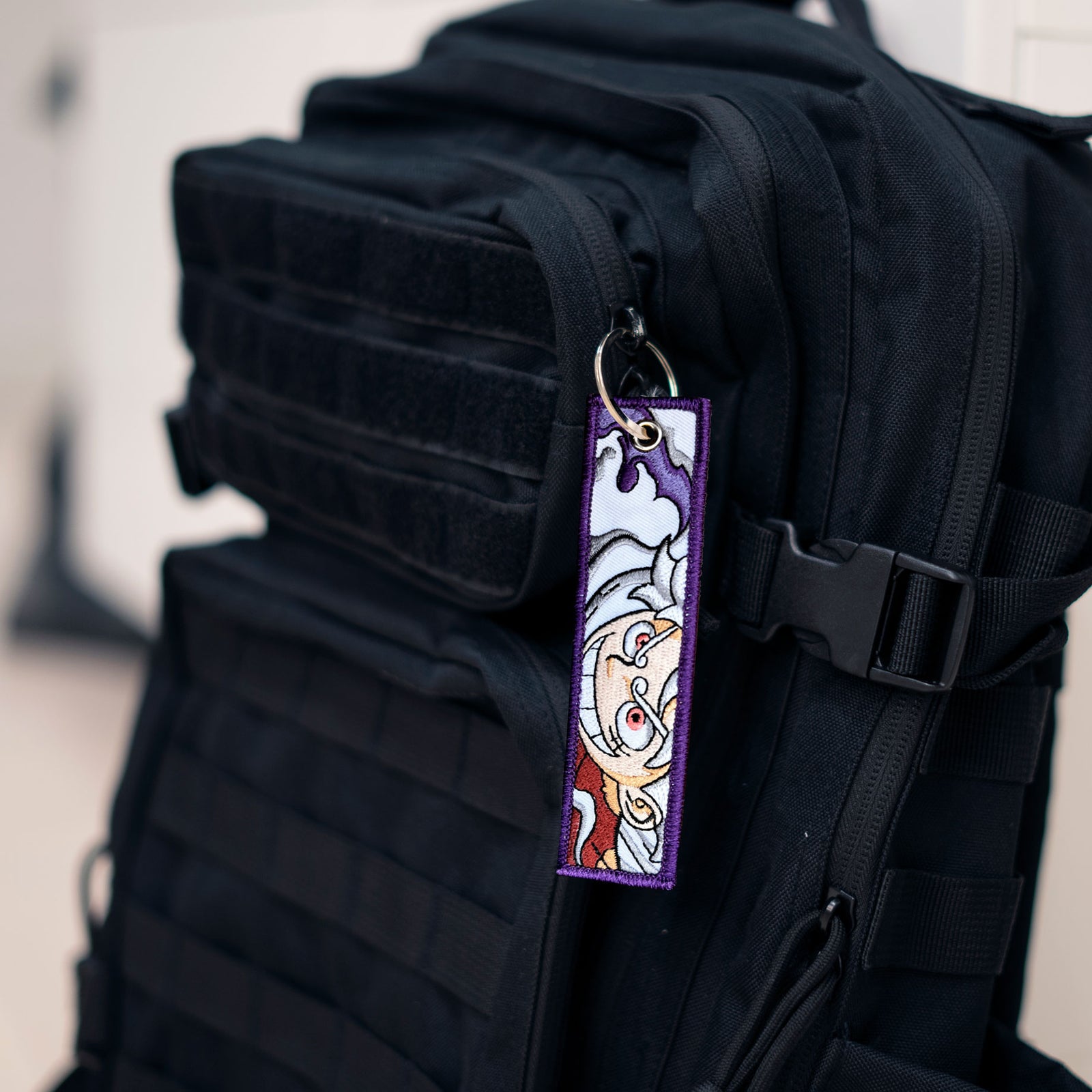 Display of Luffy Gear Five embroidered keychain – soft fabric anime keychain – Akira Gallery
