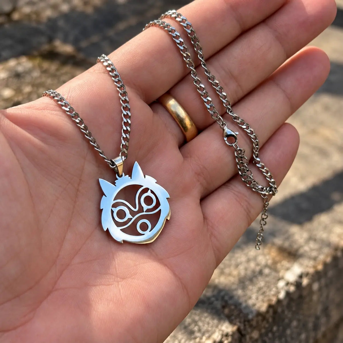 Princess Mononoke Stainless Steel Necklace from Studio Ghibli held by hand