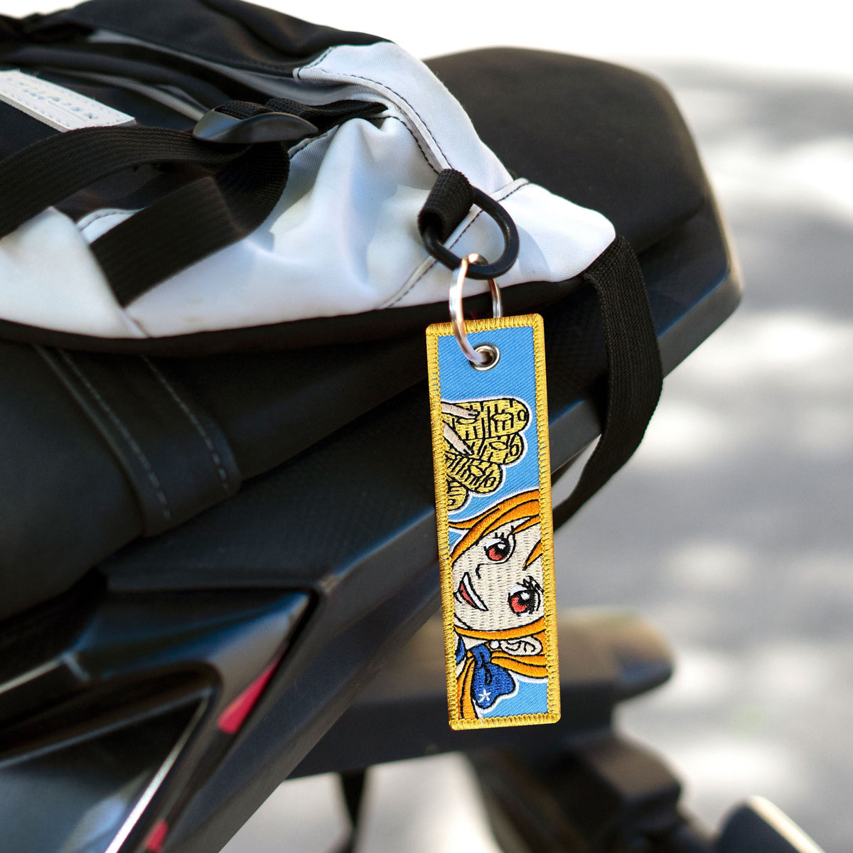 Detail of Nami embroidered keychain – soft fabric anime keychain – Akira Gallery
