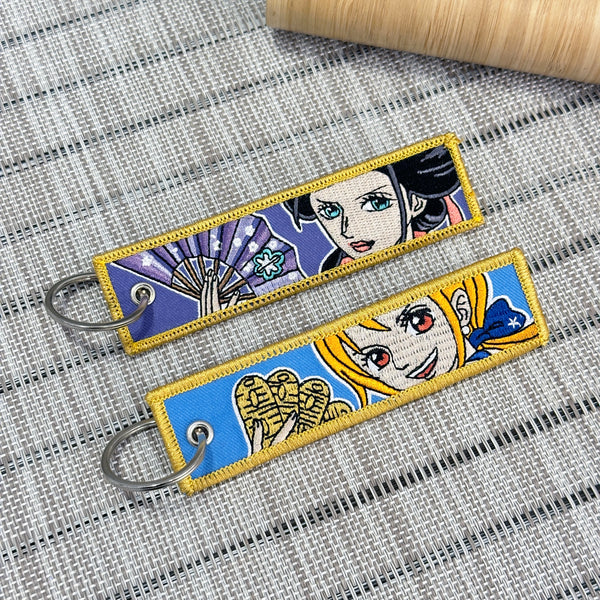 Nami &amp; Nico Robin embroidered anime keychain inspired by One Piece – Akira Gallery
