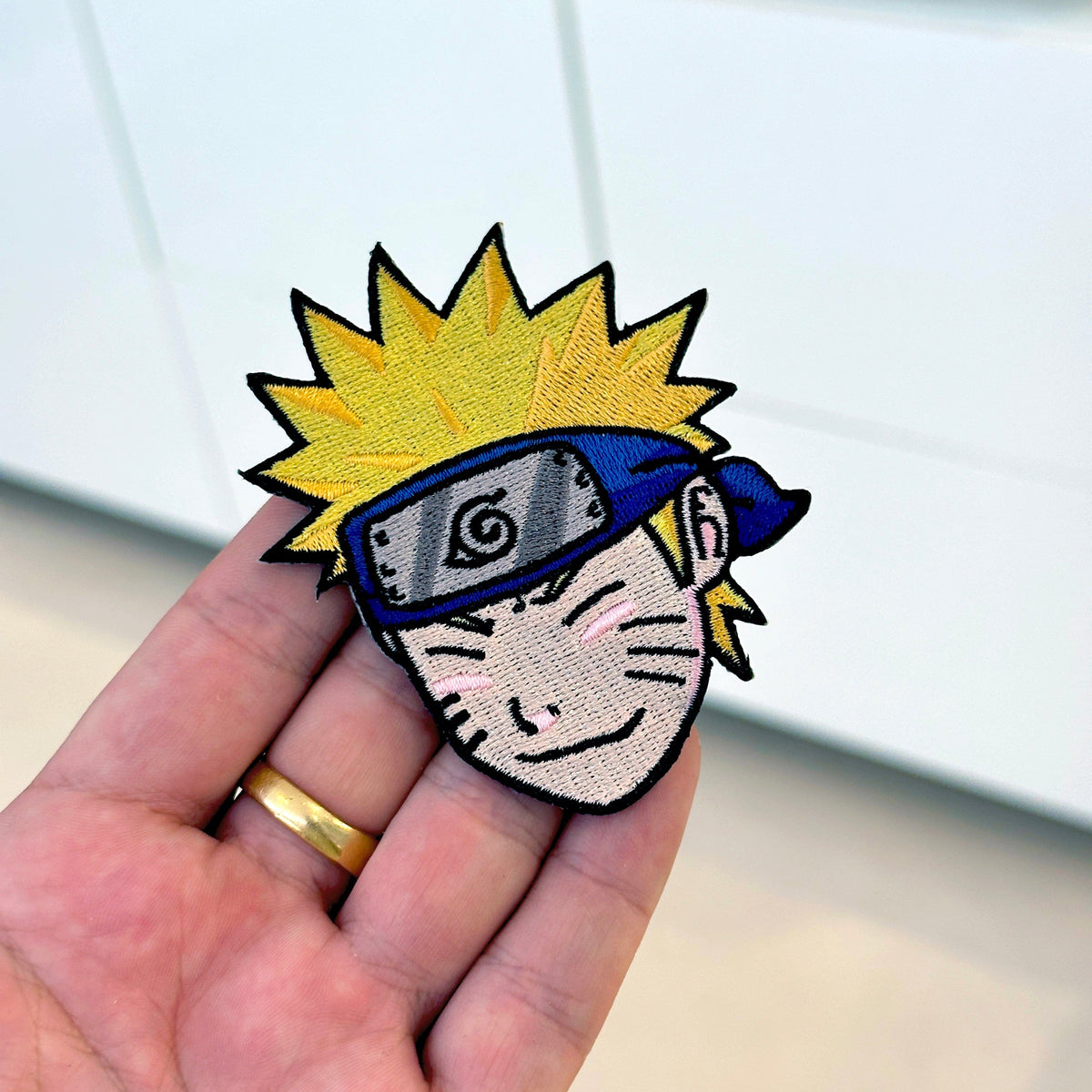 Detail of Naruto embroidered patch showing textured stitching – anime patch – Akira Gallery
