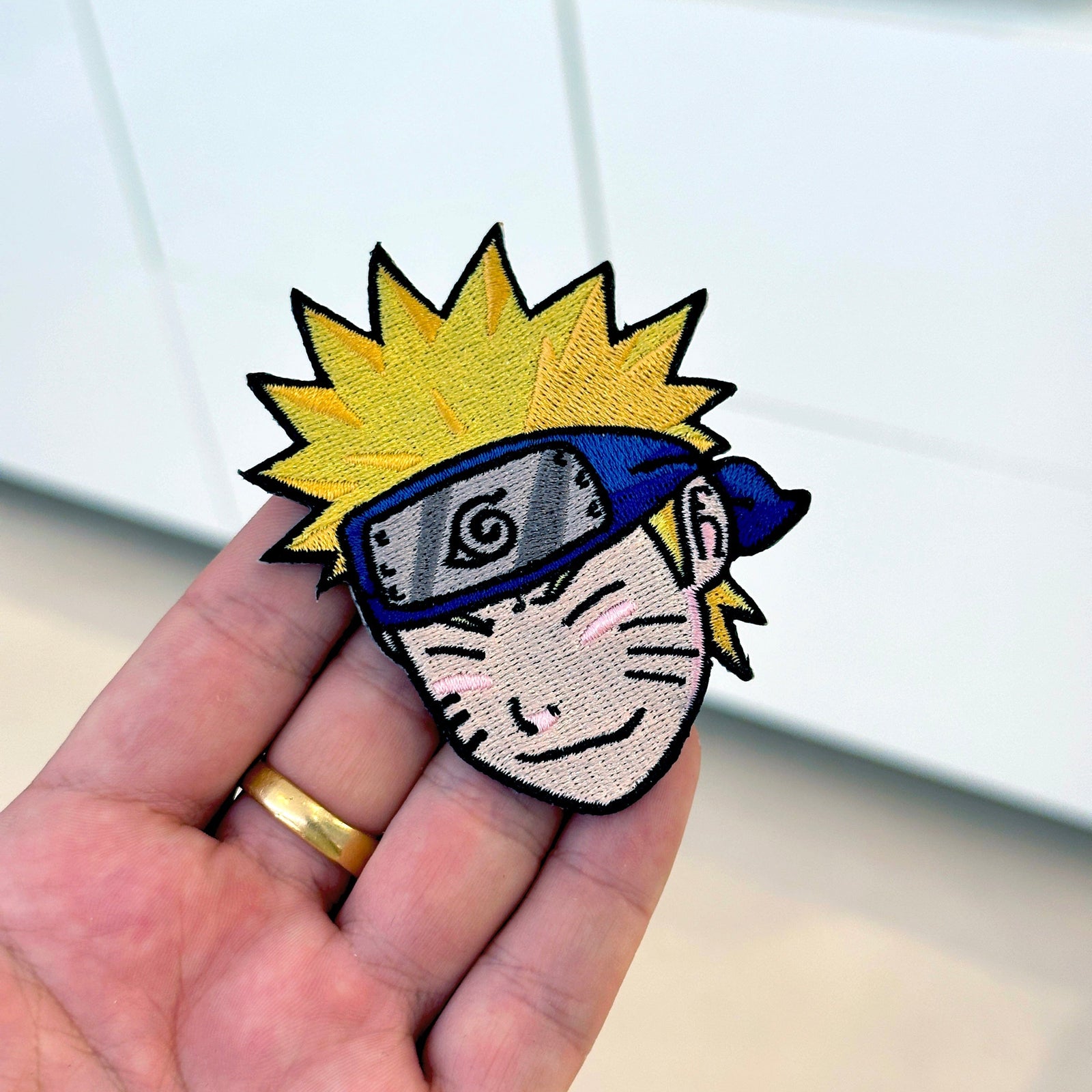 Detail of Naruto embroidered patch showing textured stitching – anime patch – Akira Gallery
