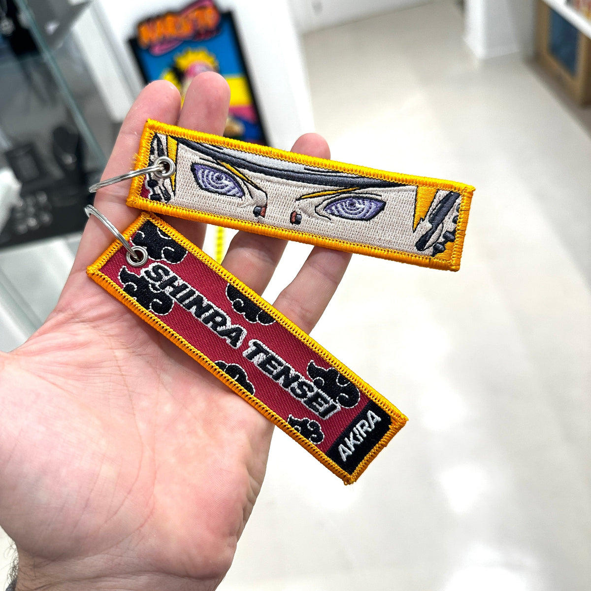 Detail of Pain embroidered keychain – soft fabric anime keychain – Akira Gallery
