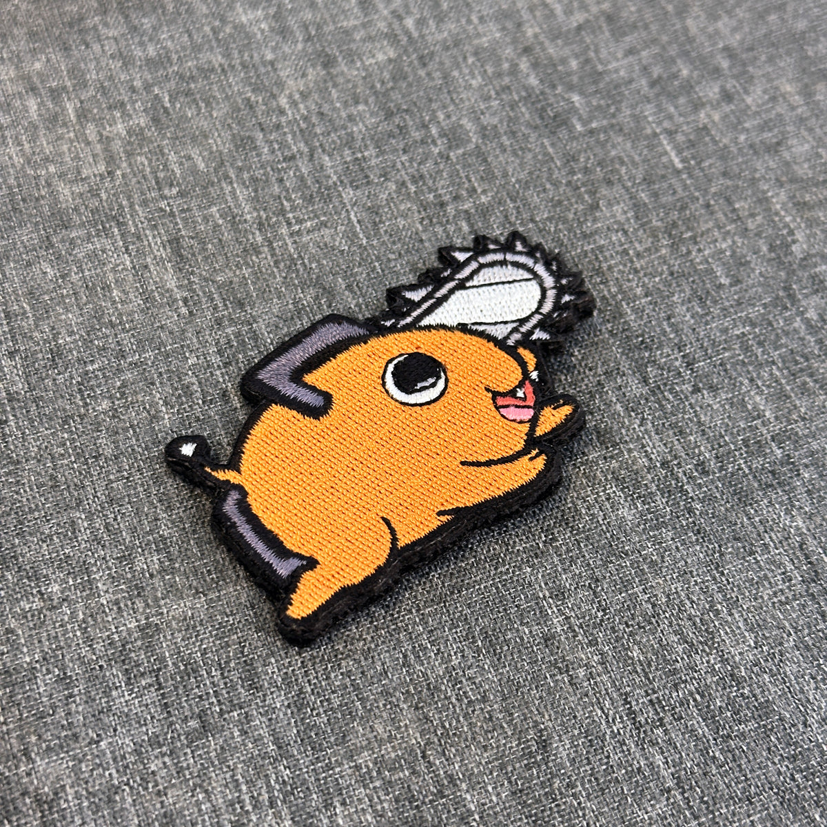 Display of Pochita embroidered anime patch – Akira Gallery
