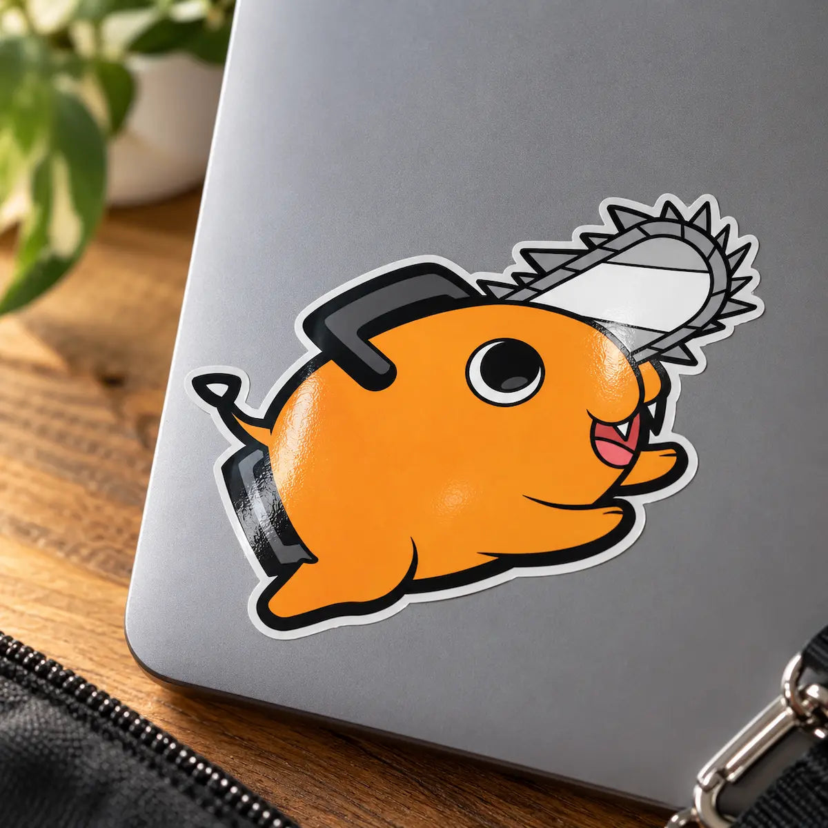 Pochita Vinyl Sticker from anime Chainsaw Man displayed on a laptop