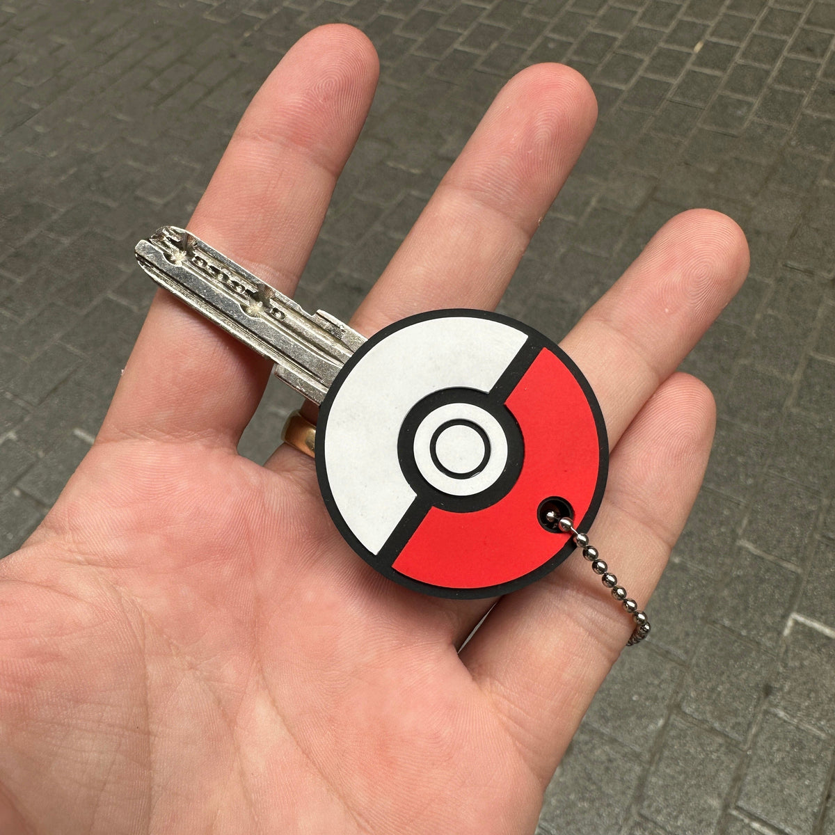 Detail of classic Poké Ball anime-style key cover – Akira Gallery
