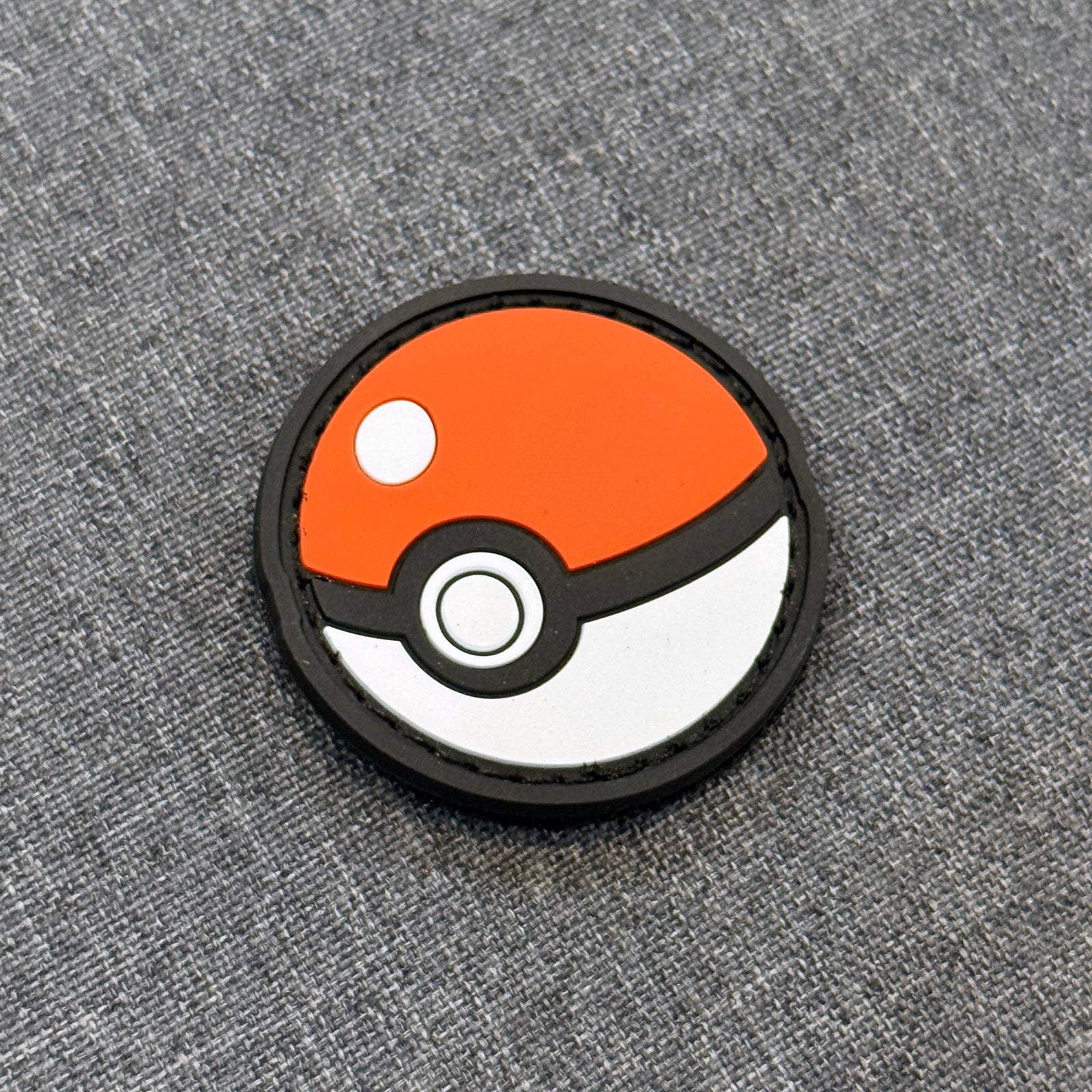 Display view of Poké Ball PVC patch with velcro backing – Akira Gallery
