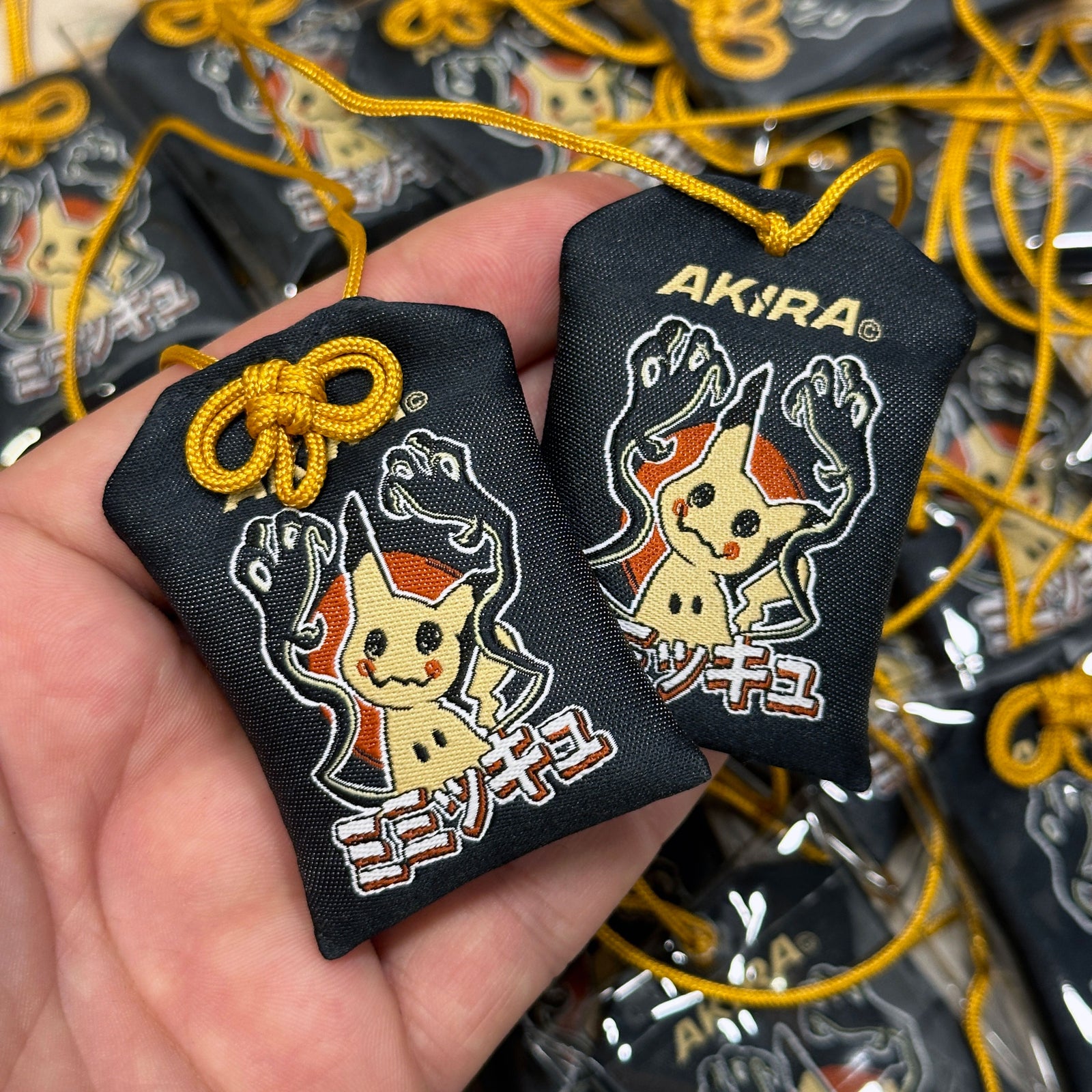 Anime-inspired Mimikyu Japanese style omamori charm
