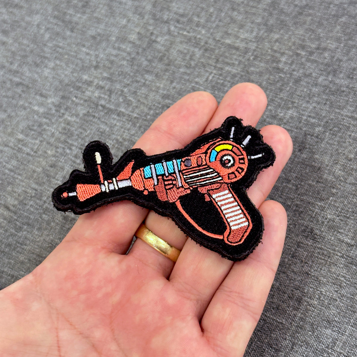 Display of Ray Gun embroidered gaming patch inspired by Call of Duty Zombies with velcro backing – Akira Gallery
