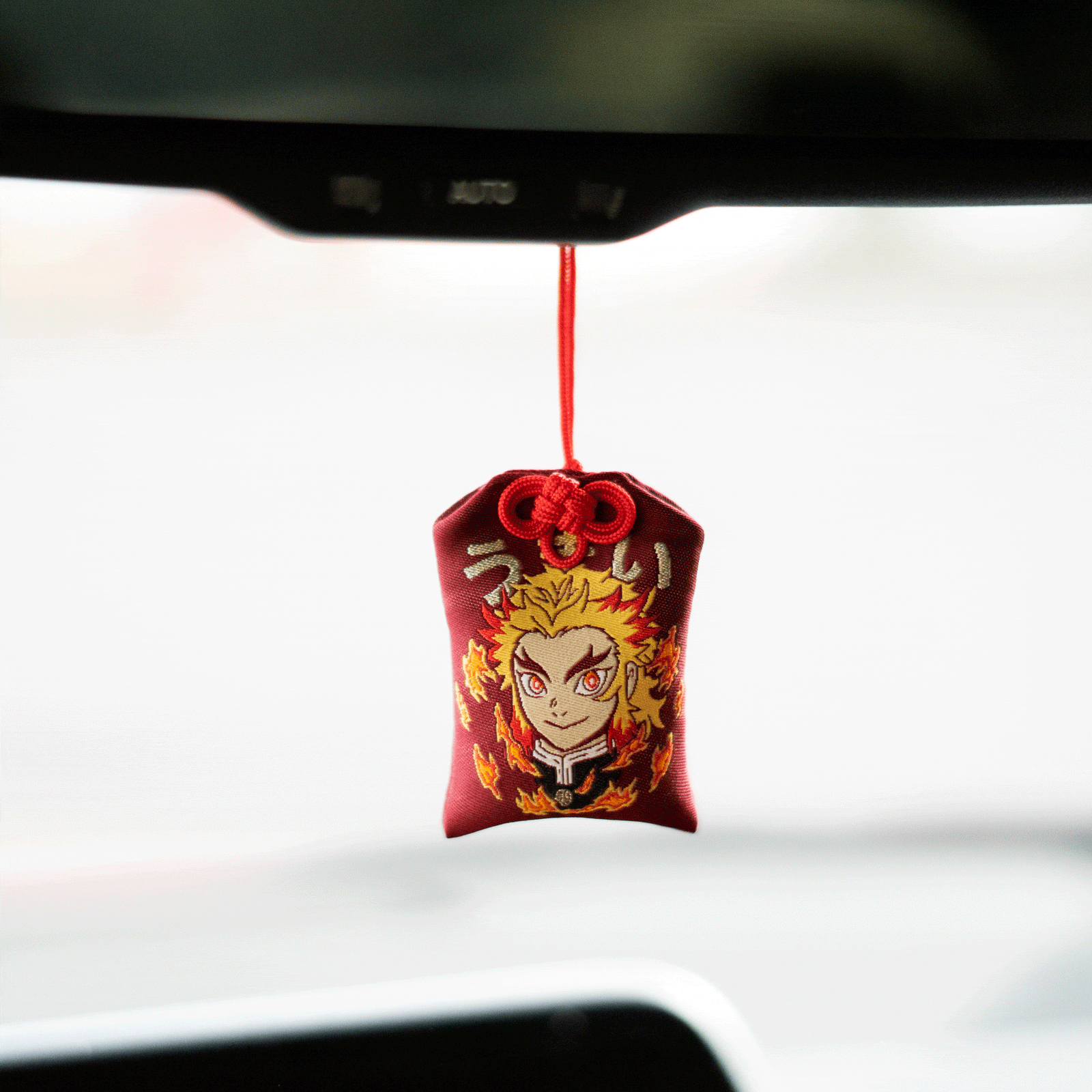 Rengoku omamori decorative charm symbolizing flame and determination
