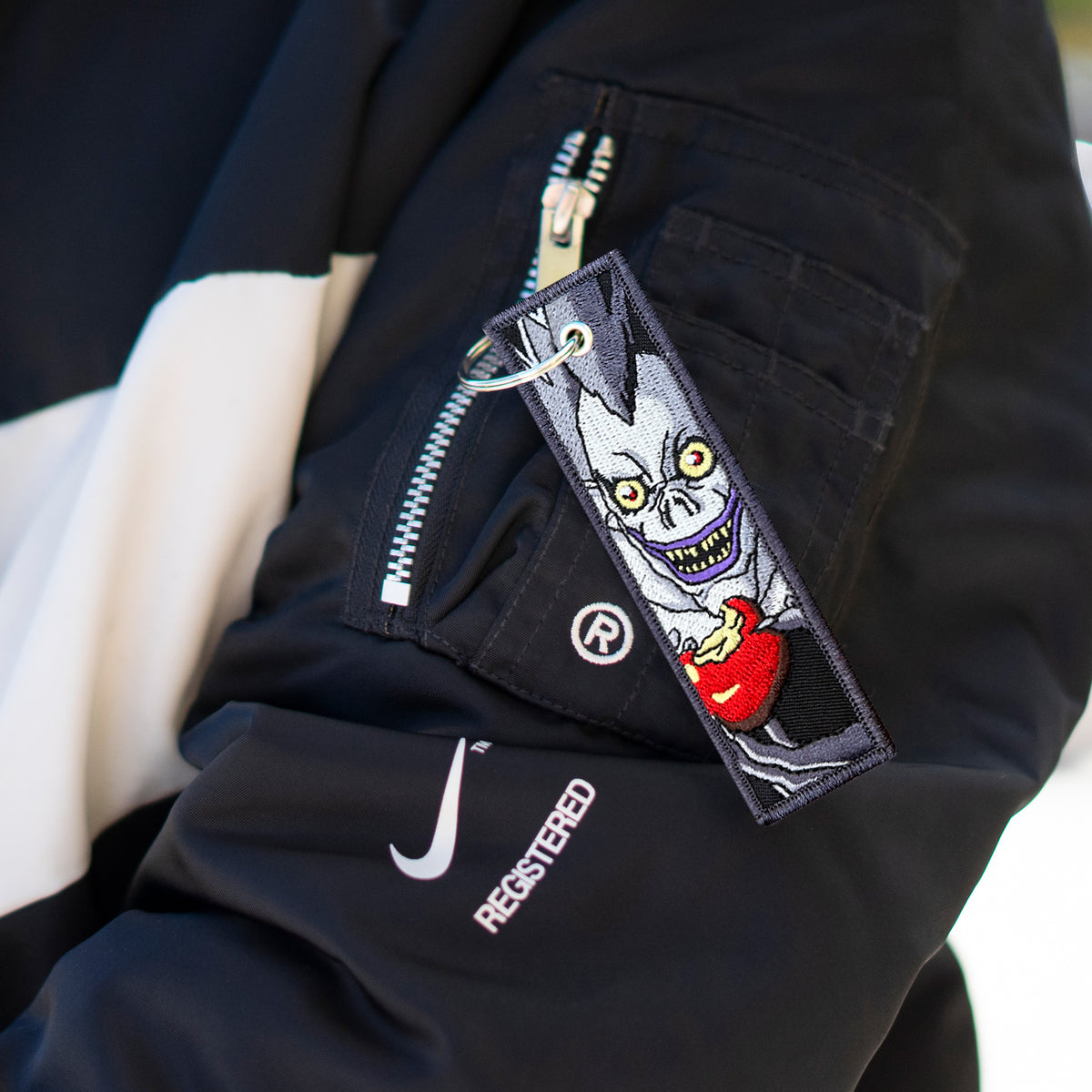 Detail of Death Note embroidered keychain with Ryuk and Light – soft fabric anime keychain – Akira Gallery
