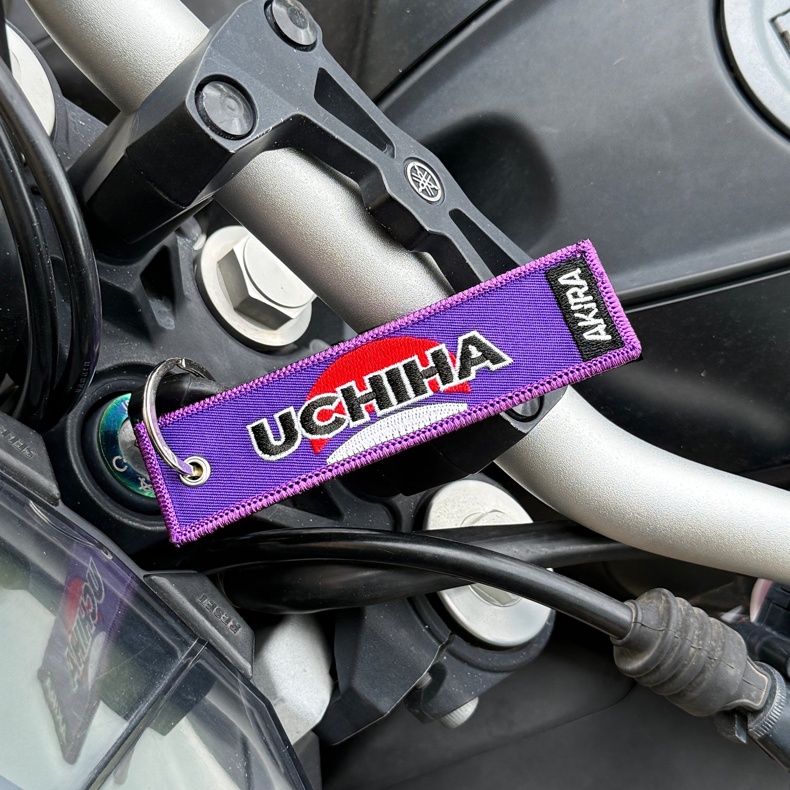 Back view of Sasuke Uchiha embroidered keychain – anime keychain – Akira Gallery
