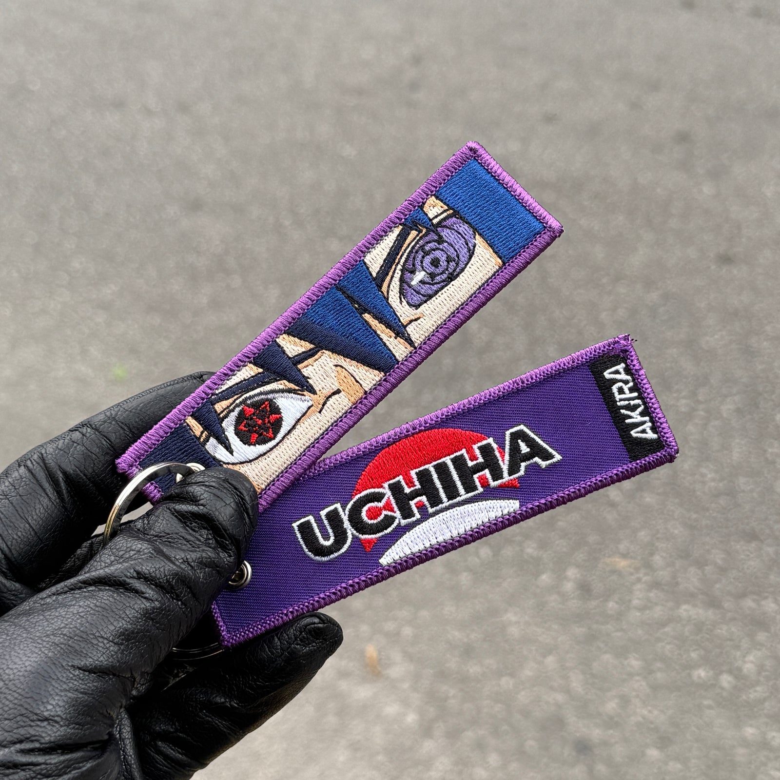 Detail of Sasuke Uchiha embroidered keychain – soft fabric anime keychain – Akira Gallery