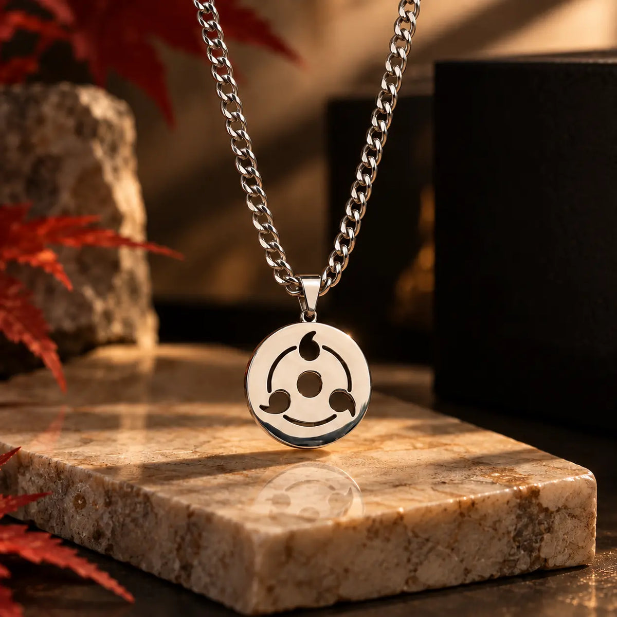Sharingan Stainless Steel Necklace displayed on marble from anime Naruto 