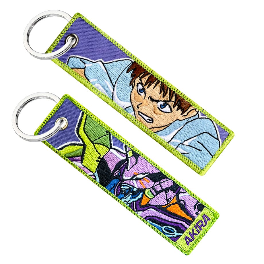 Double-sided embroidered keychain of Shinji from Evangelion. One side features the mecha Eva 01, and the other side shows Shinji with an angry expression
