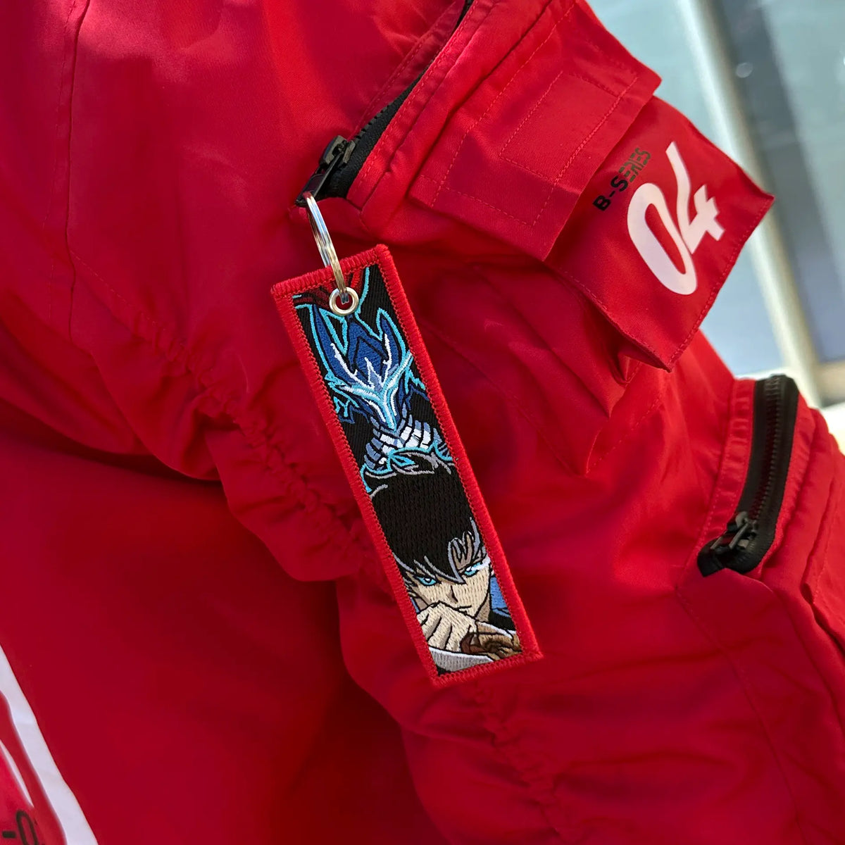 Solo Leveling Embroidered Keychain featuring Sung Jinwoo and Igris with ARISE in the back