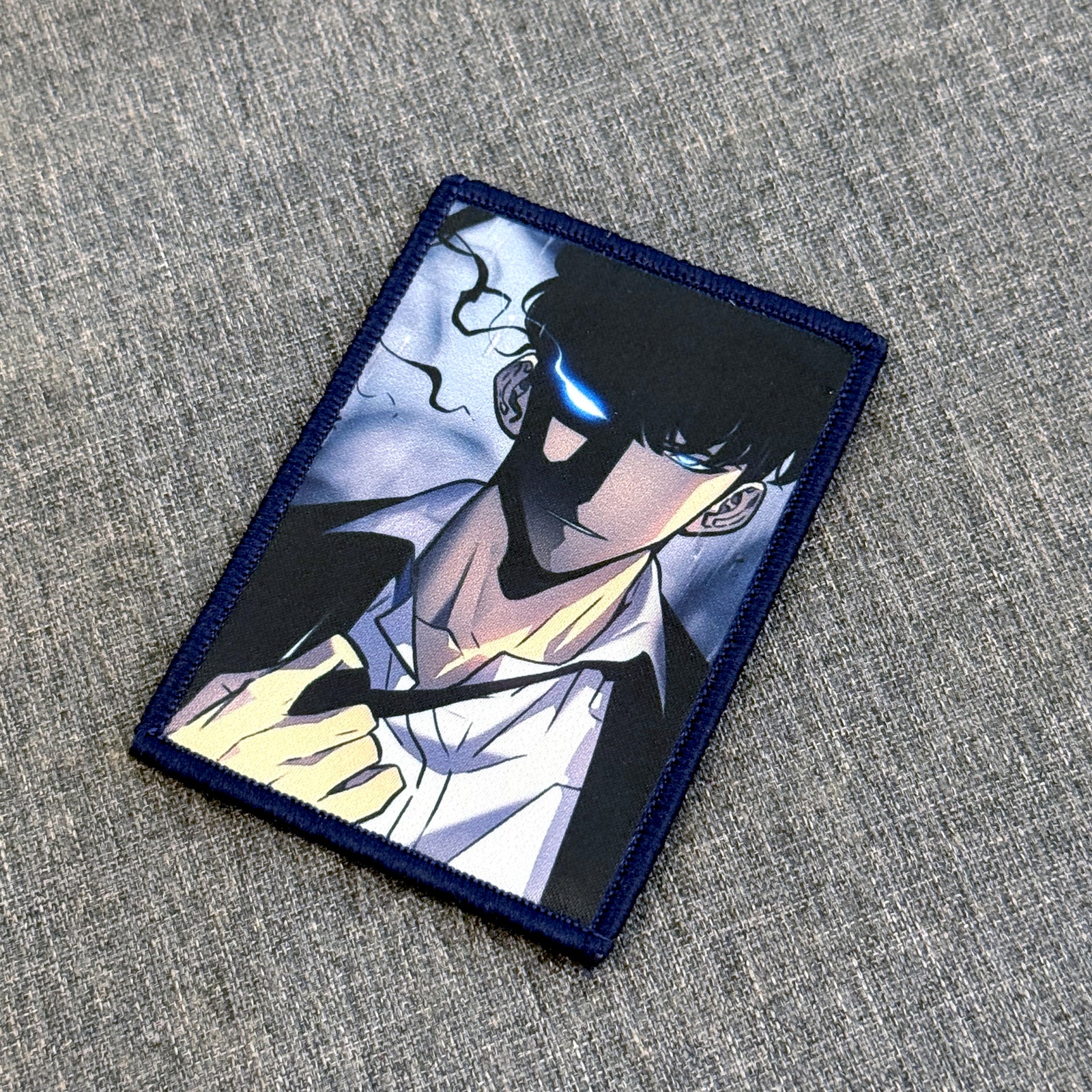 Detail of Sung Jinwoo sublimated patch showing vivid colors – anime patch – Akira Gallery
