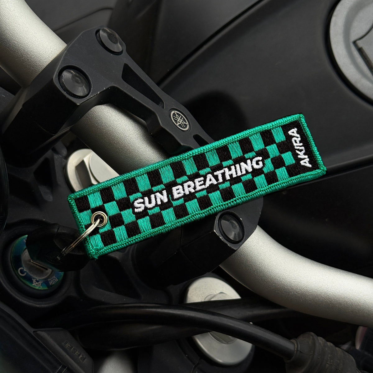 Back view of Tanjiro Kamado embroidered keychain – anime keychain – Akira Gallery
