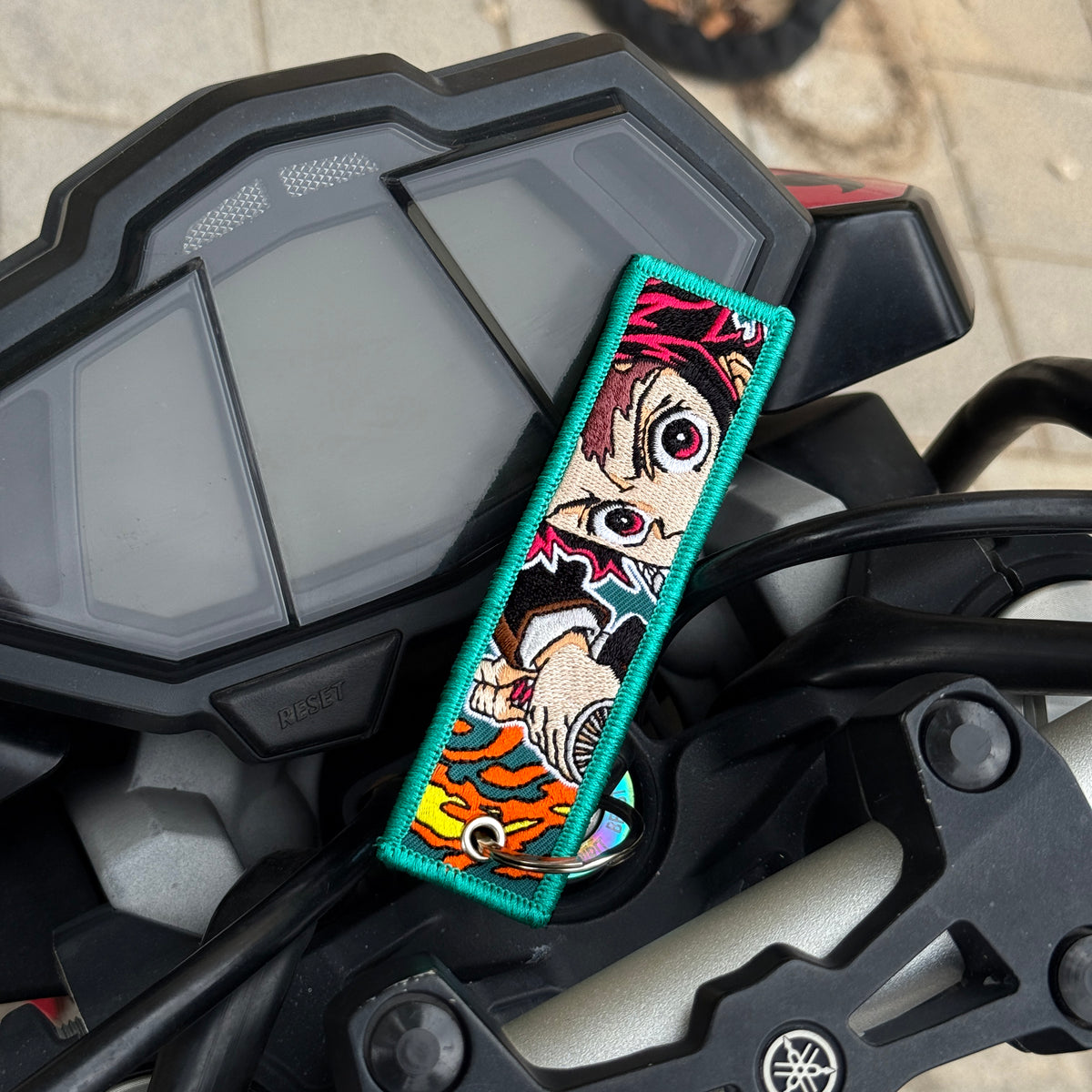 Front view of Tanjiro Kamado embroidered keychain – anime keychain – Akira Gallery
