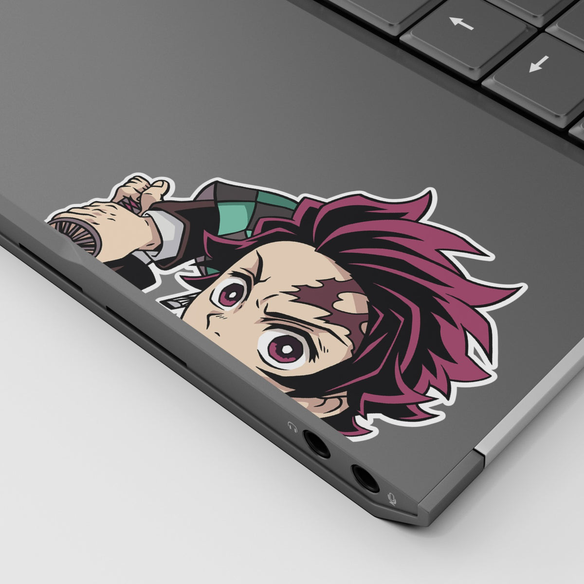 Tanjiro Kamado Vinyl Sticker Peeker from anime Demon Slayer displayed on a laptop