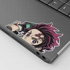 Tanjiro Kamado Vinyl Sticker Peeker from anime Demon Slayer displayed on a laptop